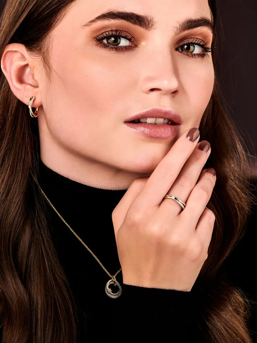 Bicolor ring gedraaid met briljant 0.13crt. + Luxe Cadeau