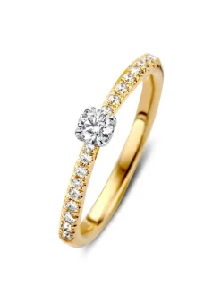 Bicolor solitairring diamant met zijstenen 0.35crt.