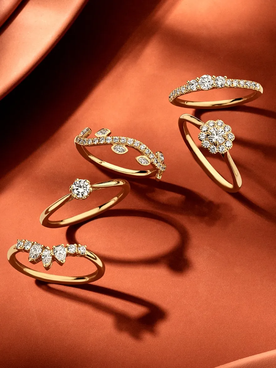 Geelgouden driesteens ring met diamant 0,46crt. + Cadeau